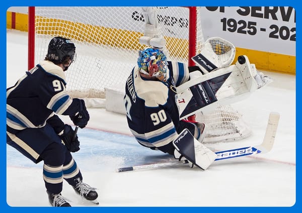 Columbus coach Rick Bowness attempts a Heimlich Maneuver