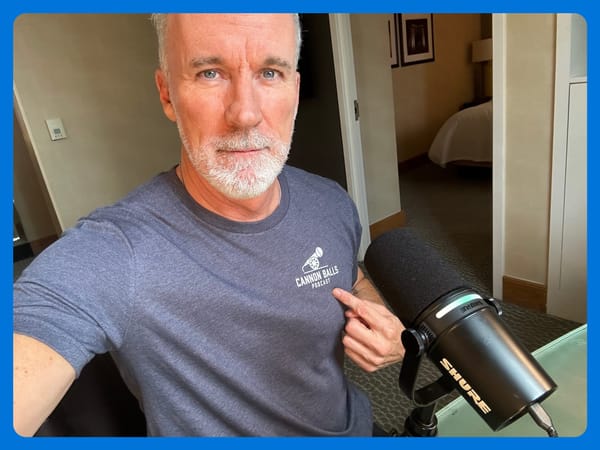 ESPN's John Buccigross wearing a Disrespected Media T-Shirt and pointing to the "Cannon Balls" logo.